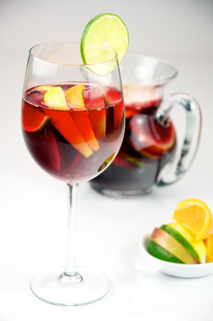 Red Wine Sangria with lemon, lime, apple, and orange served in a glass.